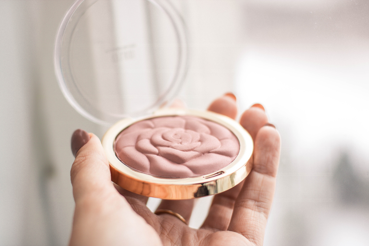 Person Holding Compact Powder